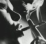 Mrs. Carter smoking a licensed brand cigarette & not ashing it 
remarks what happened, what were you doing @ ground zero?